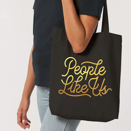 people like us black and gold tote bag